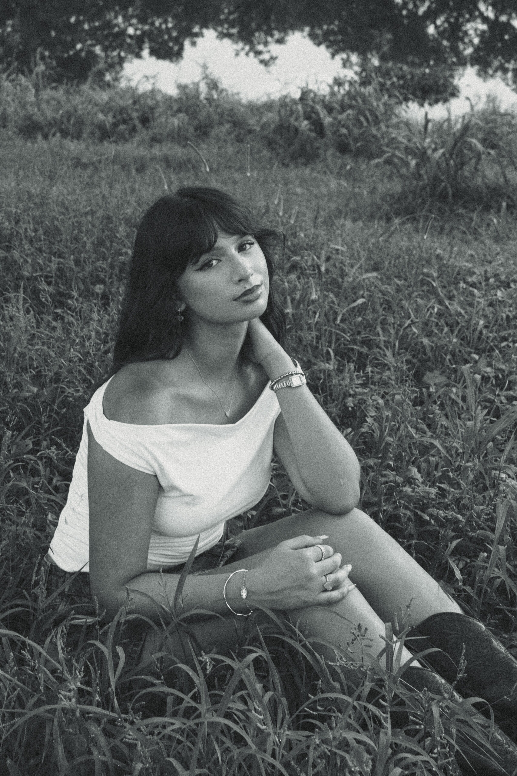 senior poses during her photoshoot with Sasha