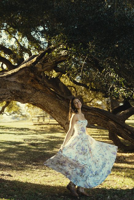senior poses during her photoshoot with Sasha