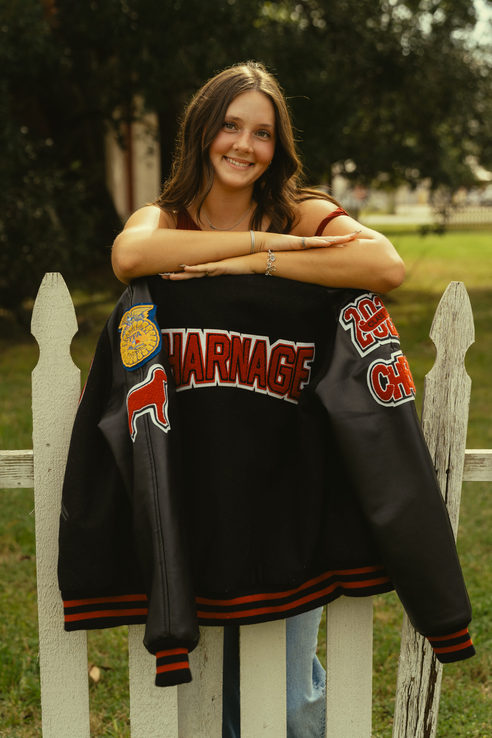 senior poses during her photoshoot with Sasha