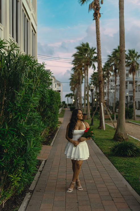 senior poses during her photoshoot with Sasha