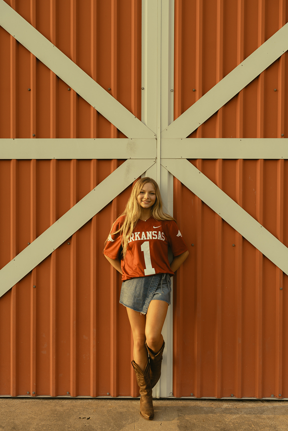 senior poses during her photoshoot with Sasha