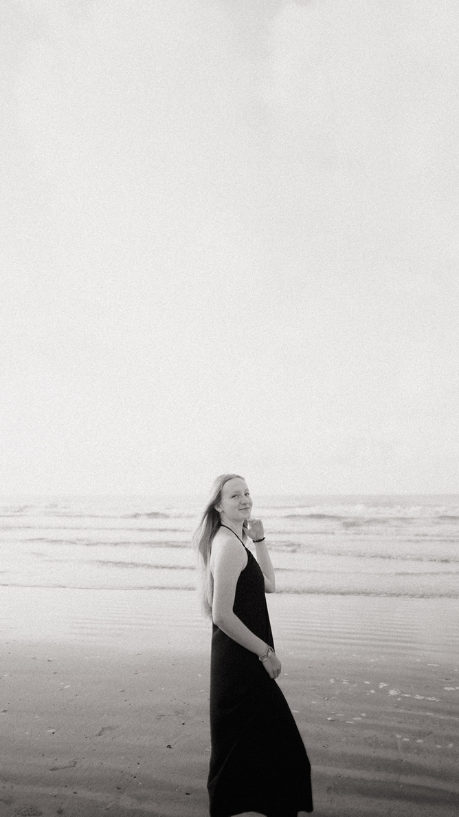 senior poses during her photoshoot with Sasha