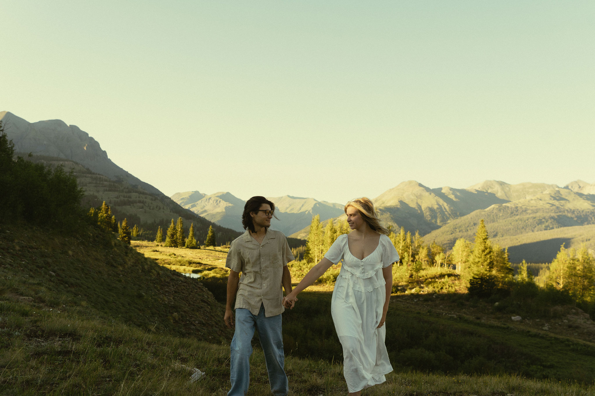 beautiful setting of high alpine meadows as the sunset hits the valley