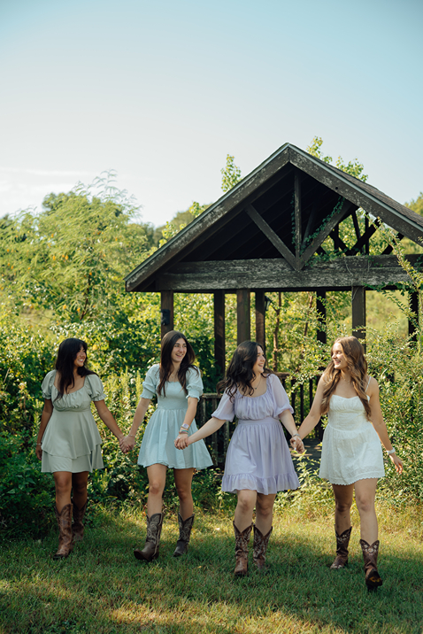 group of girls walk and laugh together